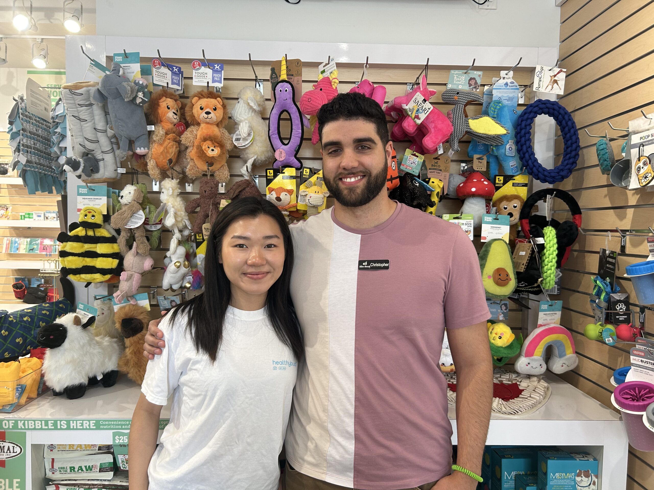 A man and woman in front of pet products at the pet store